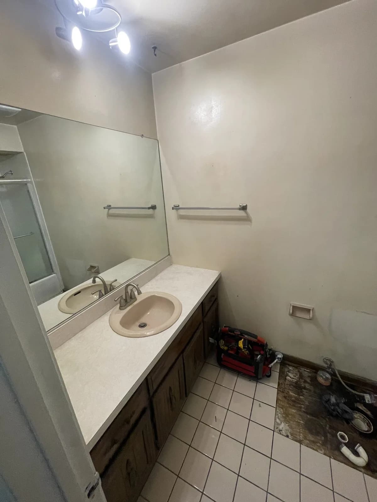Dated Aurora bathroom with an old vanity before the Navarro remodel