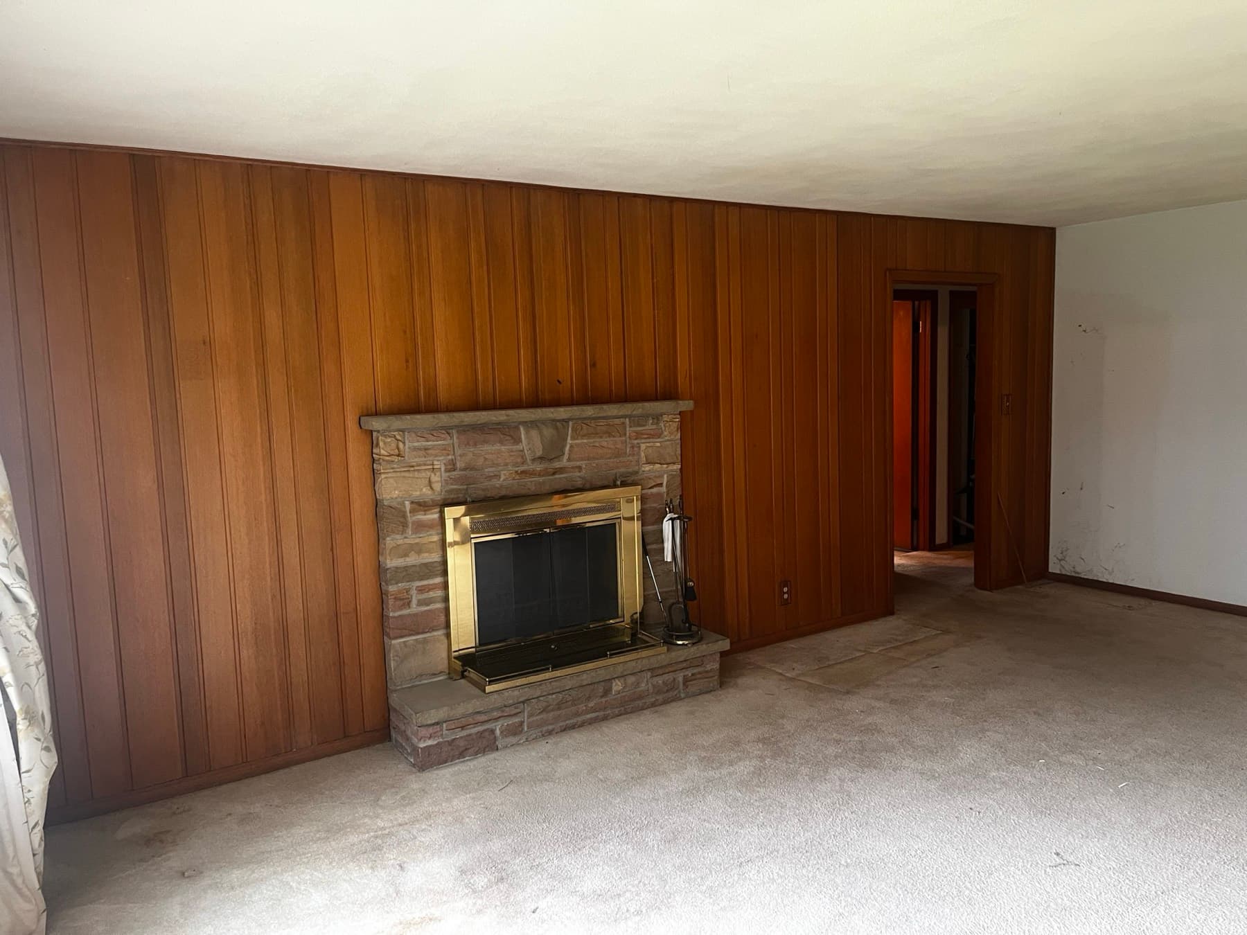 West Aurora living room before remodeling, with worn finishes